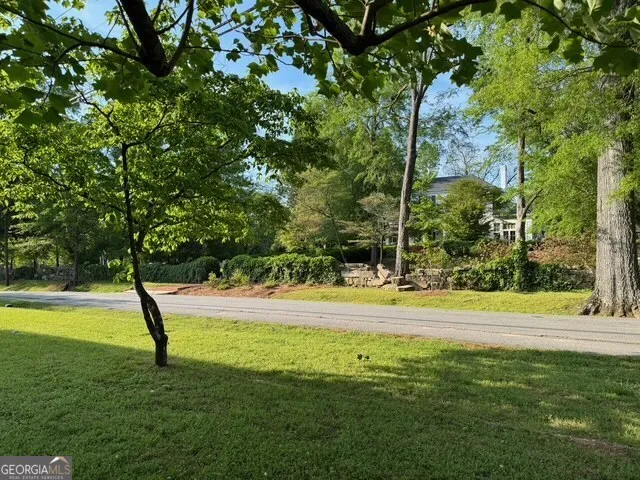 a view of a swimming pool with a backyard