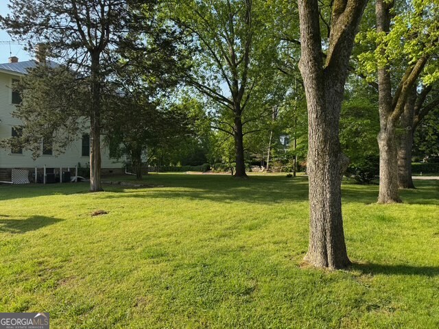 222 Church Street Lexington, GA 30648 - Photo 46 of 50 a view of a swimming pool with a backyard