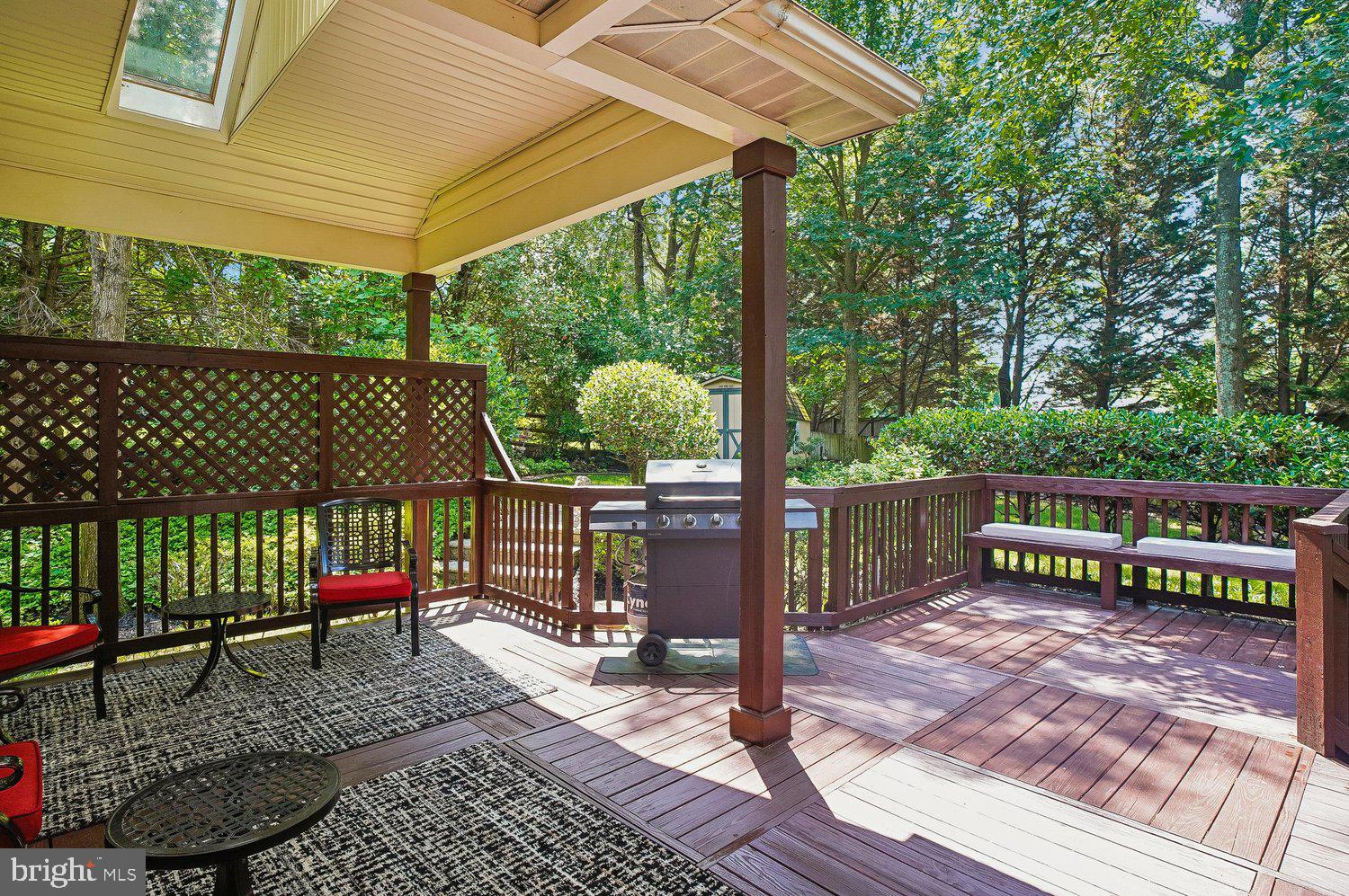 217 Raccoon Run Court Hanover, MD 21076 - Photo 8 of 38 a view of a wooden deck with a bench
