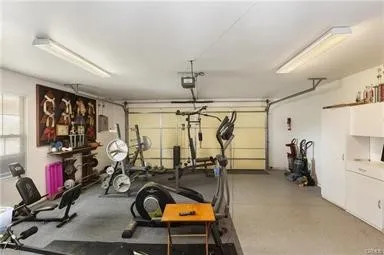 a view of a room with furniture and wooden floor