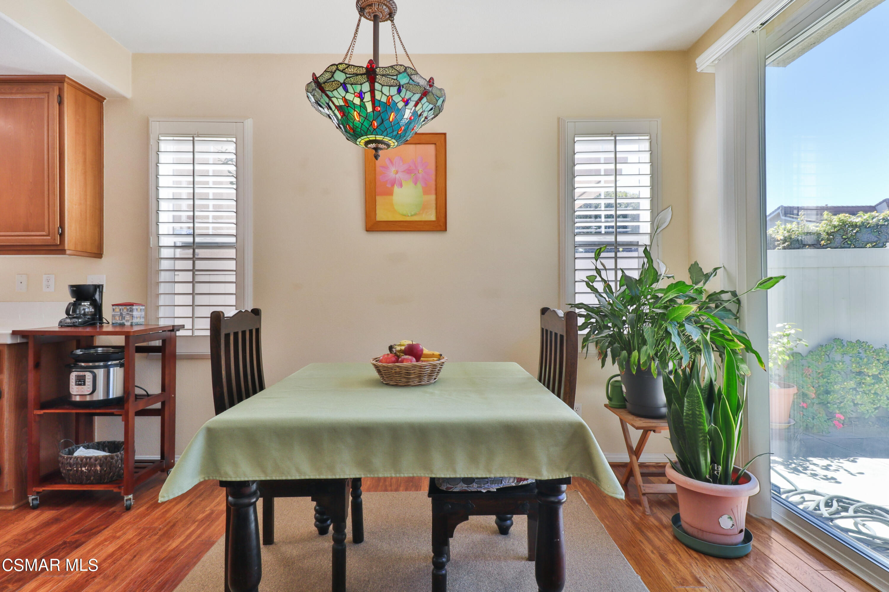 5281 Davidson Drive Oxnard, CA 93033 - Photo 13 of 38 a view of a dining room with furniture window and wooden floor