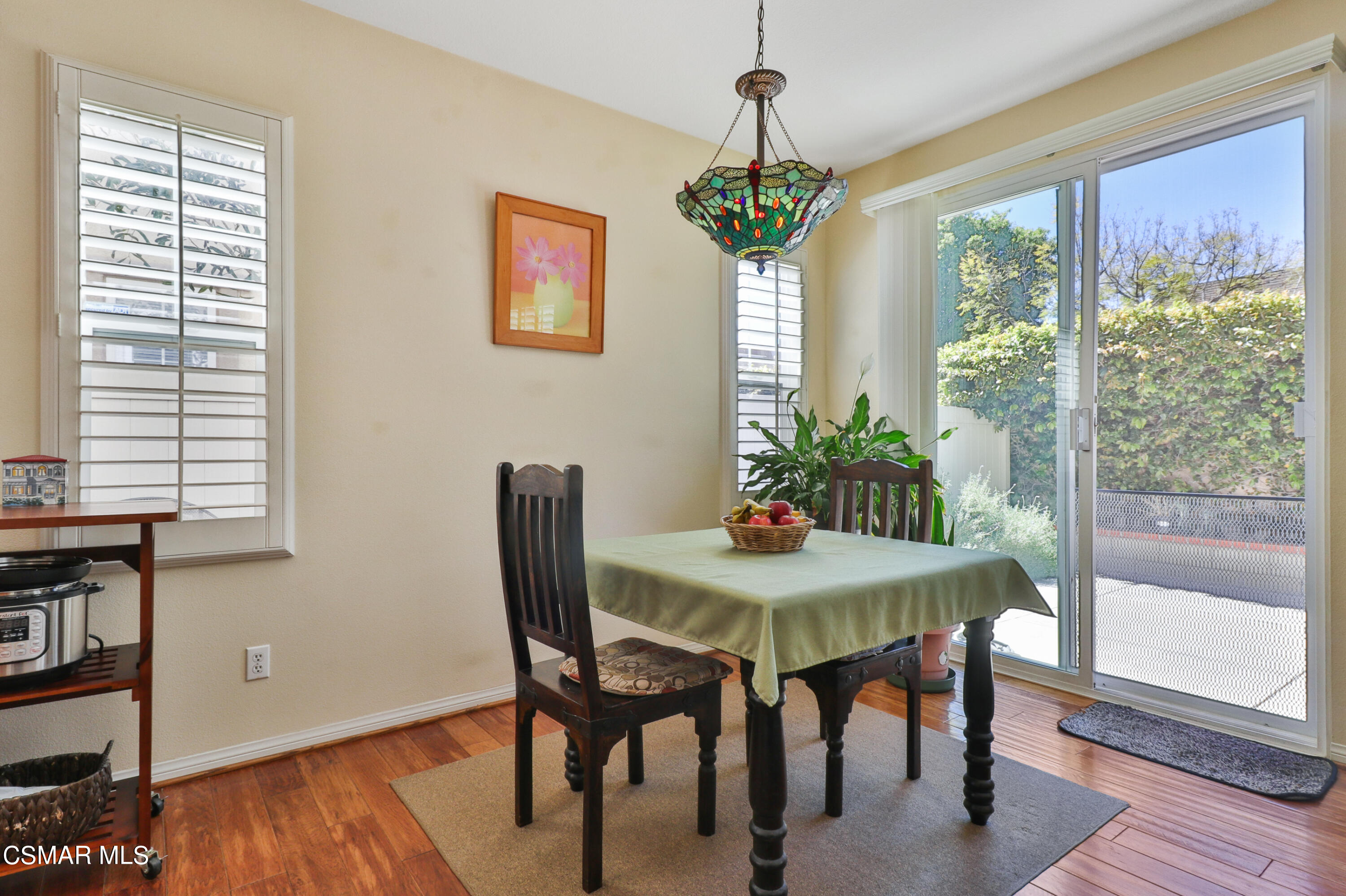 5281 Davidson Drive Oxnard, CA 93033 - Photo 14 of 38 a view of a dining room with furniture window and wooden floor