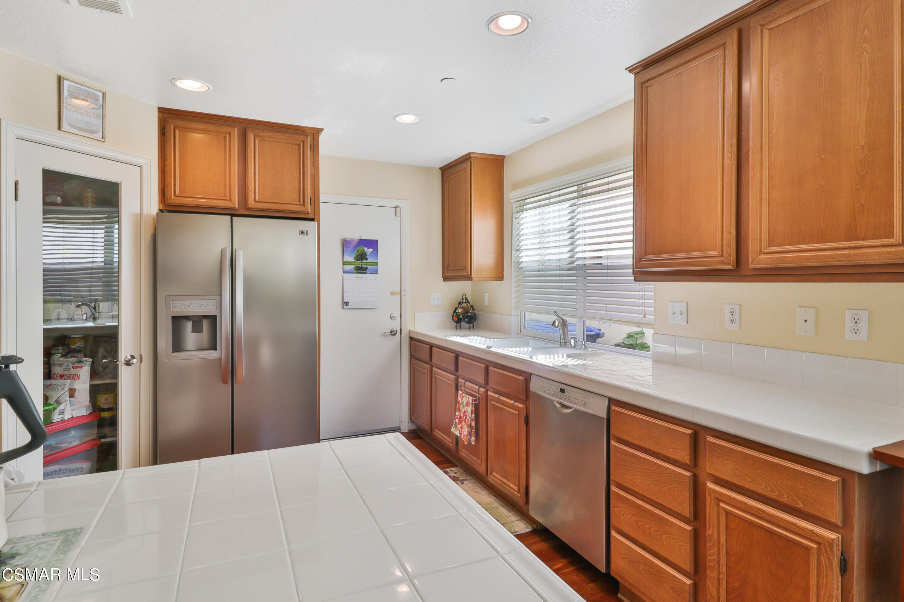 5281 Davidson Drive Oxnard, CA 93033 - Photo 16 of 38 a kitchen with stainless steel appliances granite countertop a refrigerator and a sink