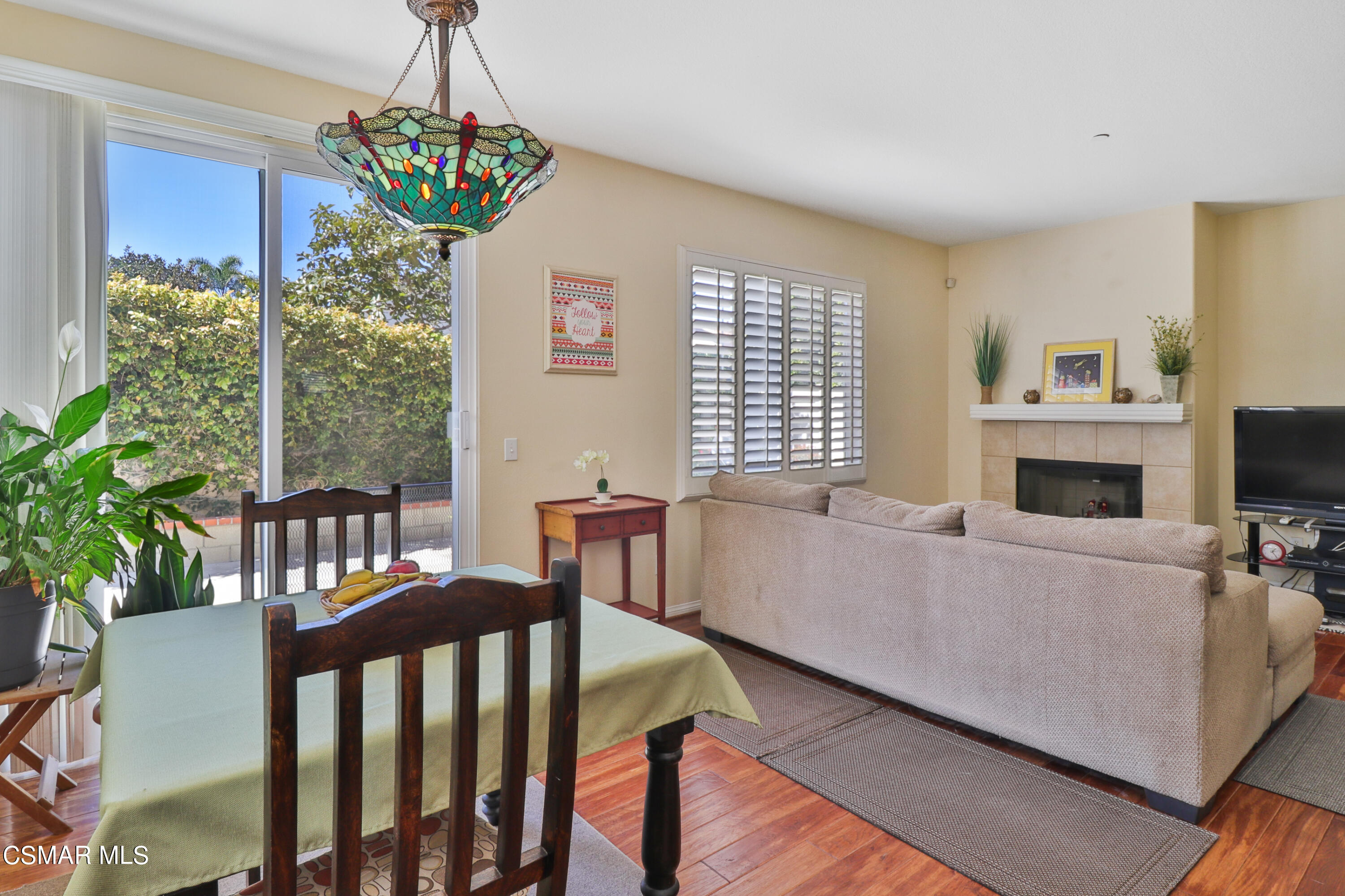 5281 Davidson Drive Oxnard, CA 93033 - Photo 21 of 38 a living room with furniture a fireplace and a chandelier