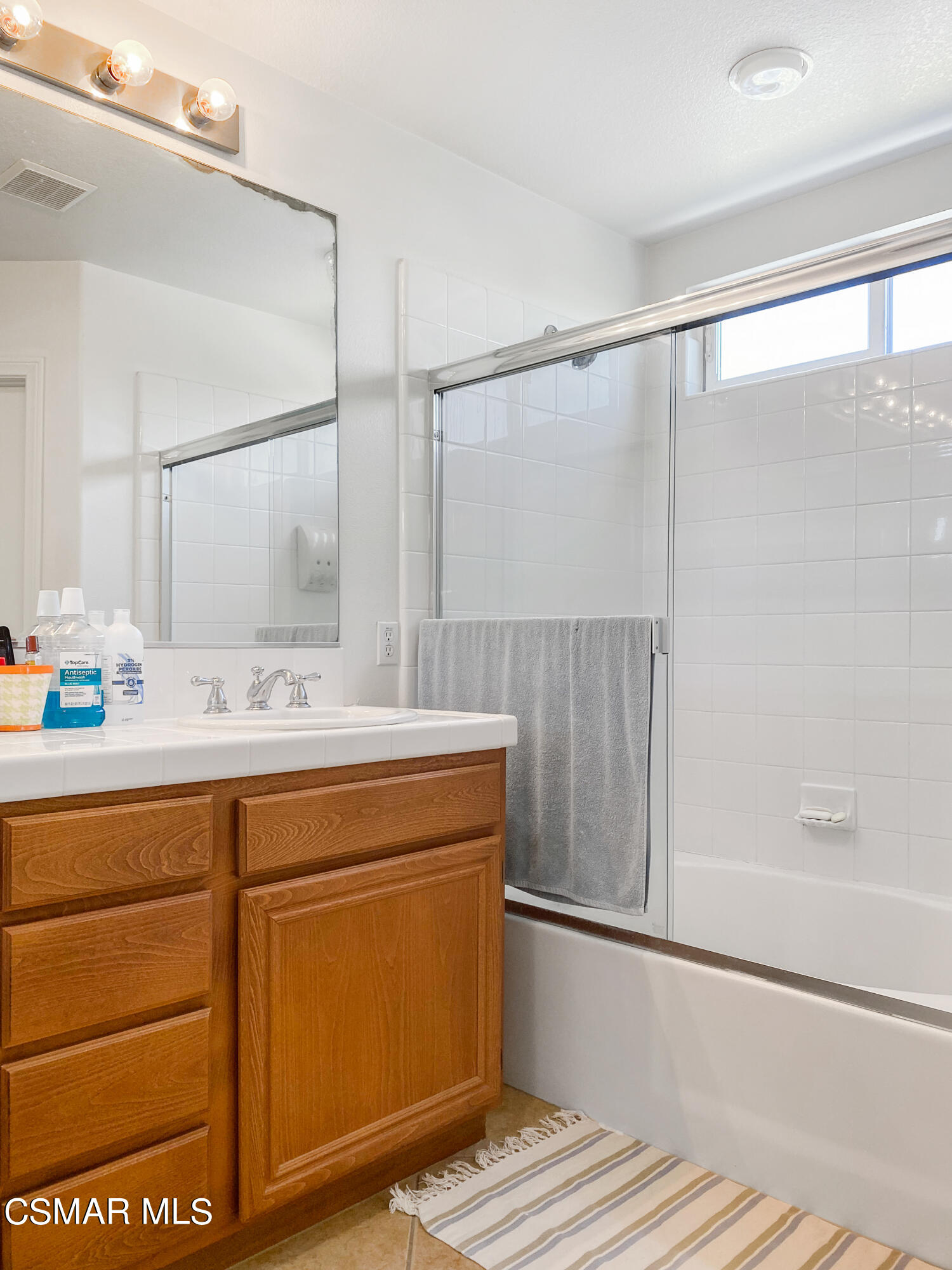 5281 Davidson Drive Oxnard, CA 93033 - Photo 25 of 38 a bathroom with a sink and a mirror
