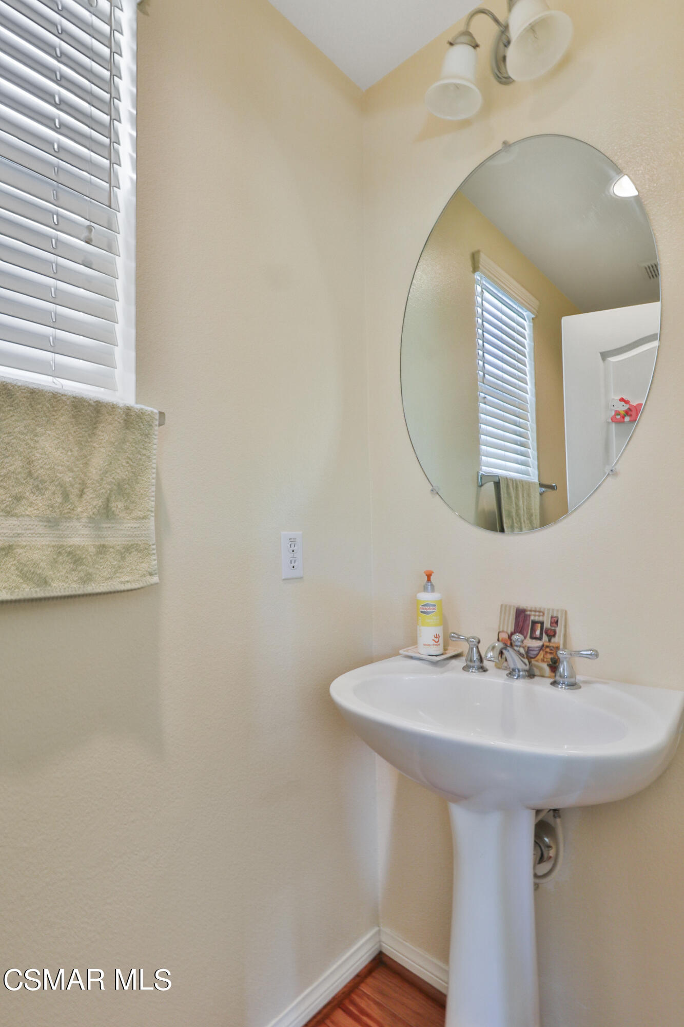 5281 Davidson Drive Oxnard, CA 93033 - Photo 26 of 38 a bathroom with a sink a mirror and a shower