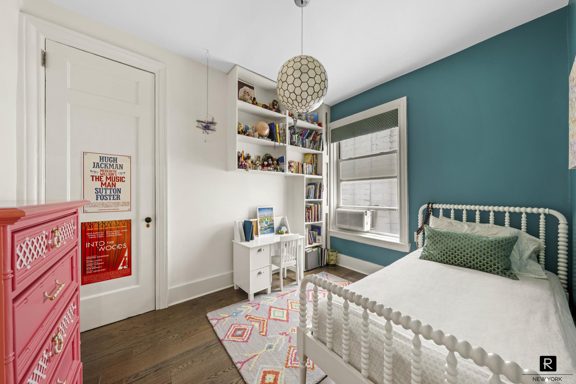 261 West 22nd Street, Unit 24/25/26 Manhattan, NY 10011 - Photo 19 of 22 a bedroom with furniture and a large window