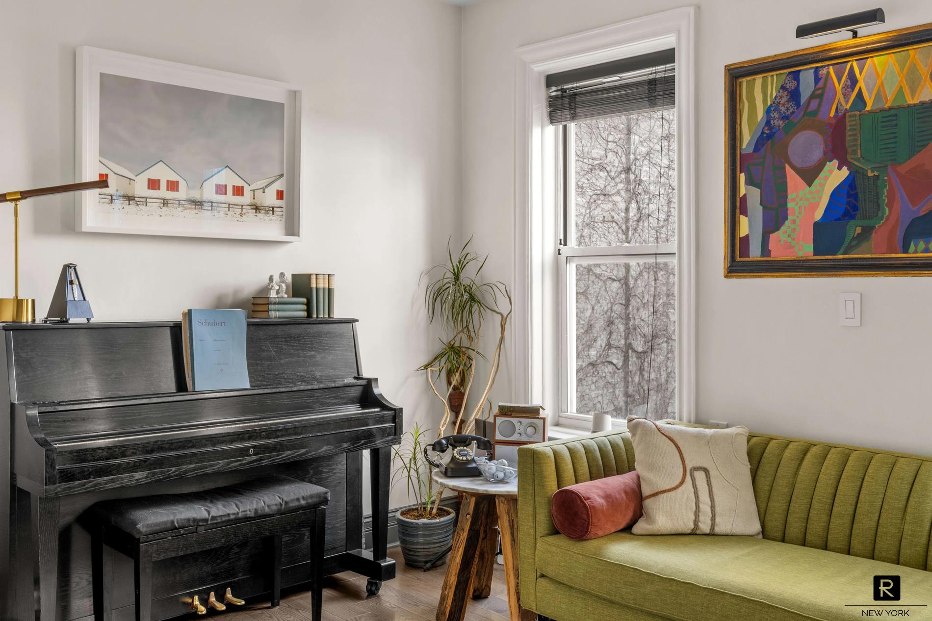 261 West 22nd Street, Unit 24/25/26 Manhattan, NY 10011 - Photo 4 of 22 a living room with furniture and a potted plant