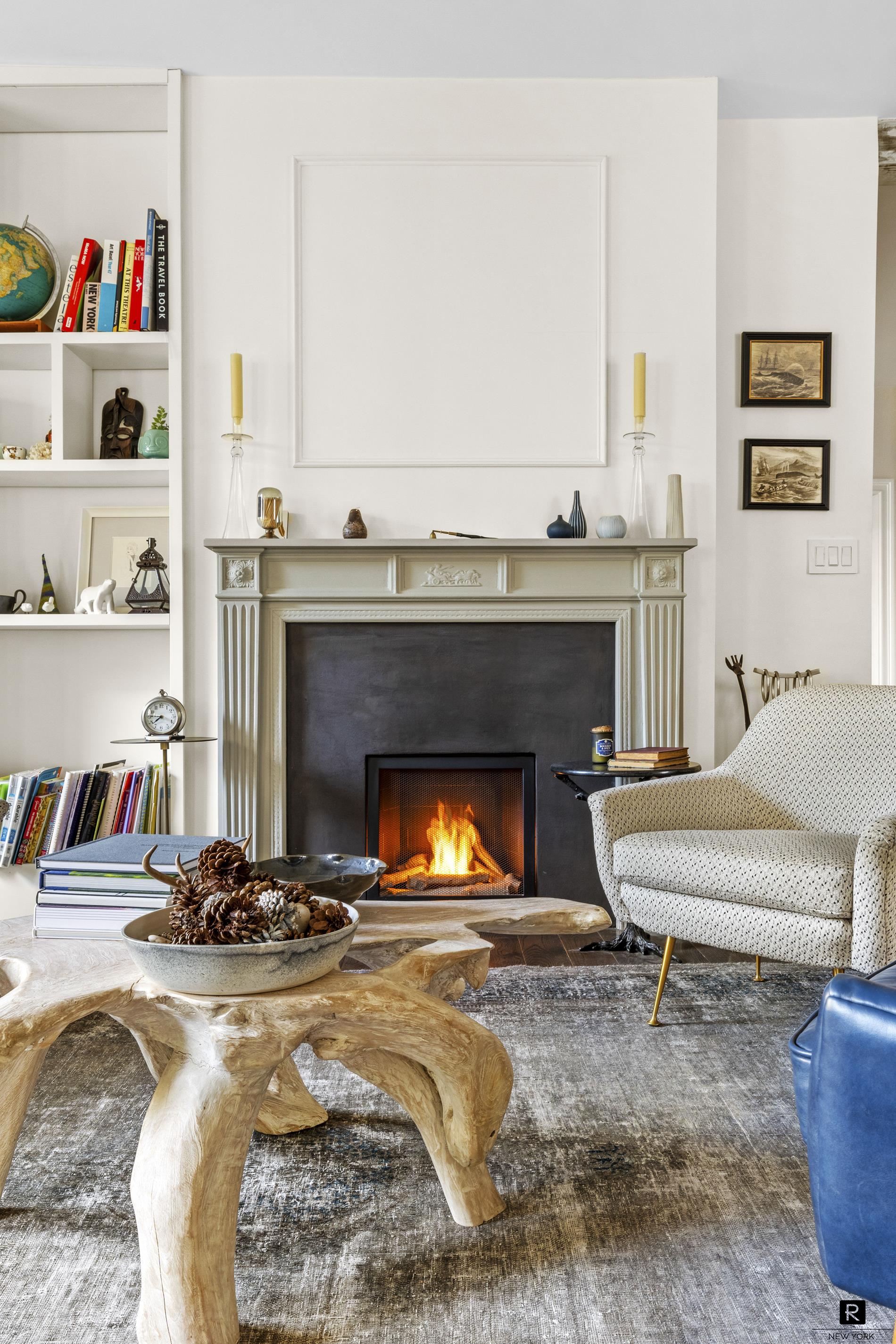 261 West 22nd Street, Unit 24/25/26 Manhattan, NY 10011 - Photo 5 of 22 a living room with furniture and a fireplace