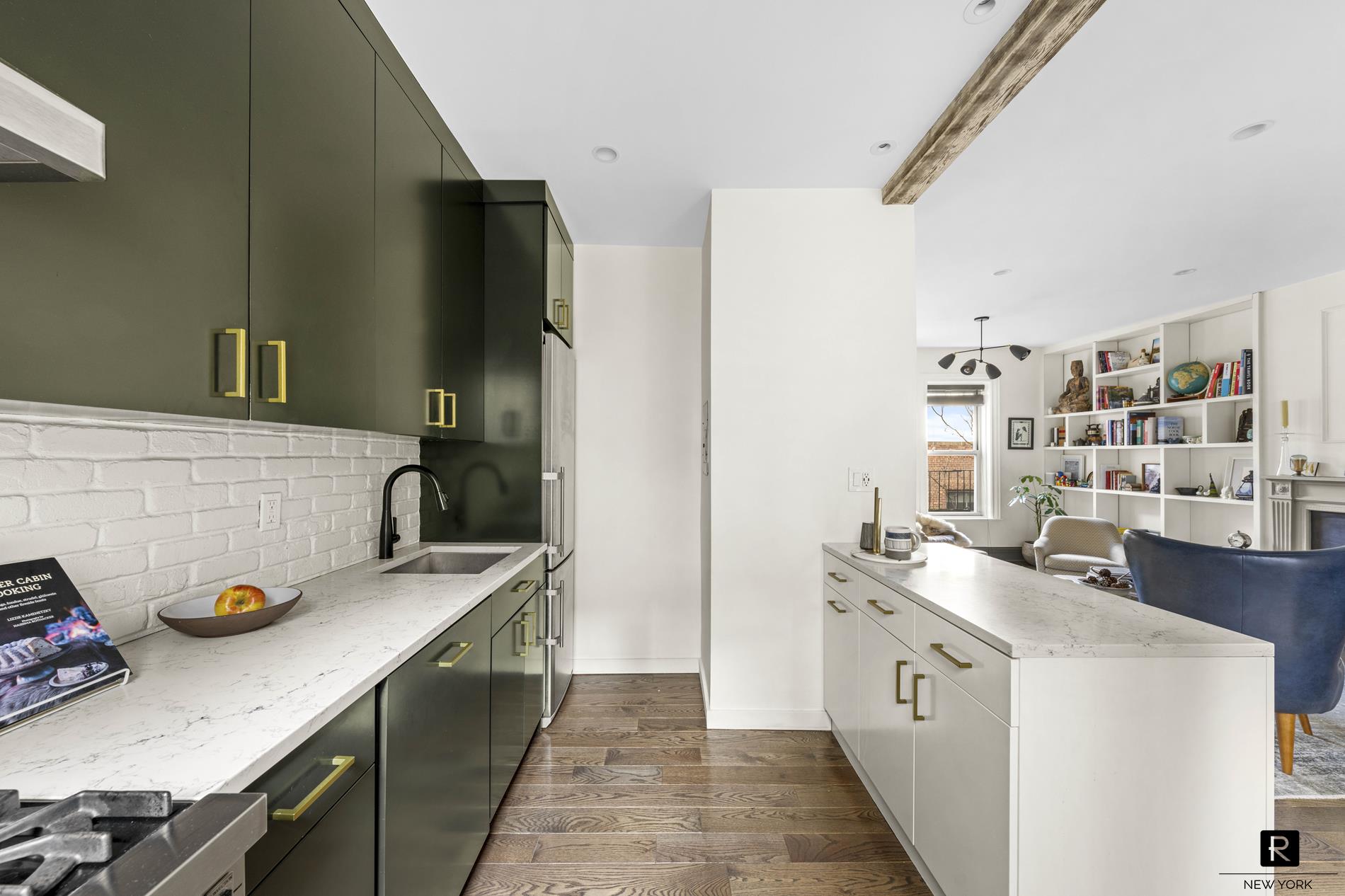 261 West 22nd Street, Unit 24/25/26 Manhattan, NY 10011 - Photo 8 of 22 a kitchen with a sink stove and refrigerator