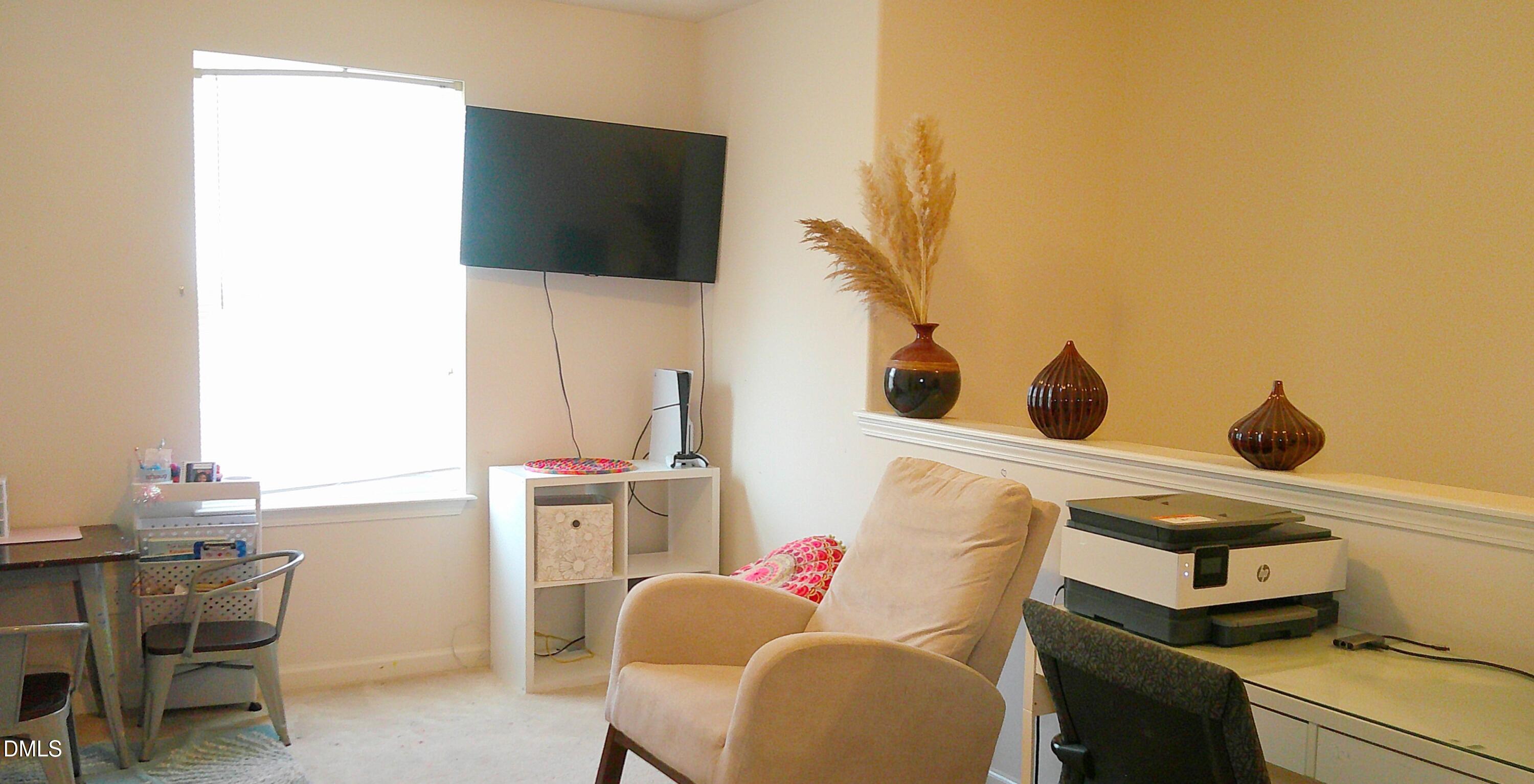 325 Huckleberry Loop Mebane, NC 27302 - Photo 11 of 24 a living room with furniture and a flat screen tv