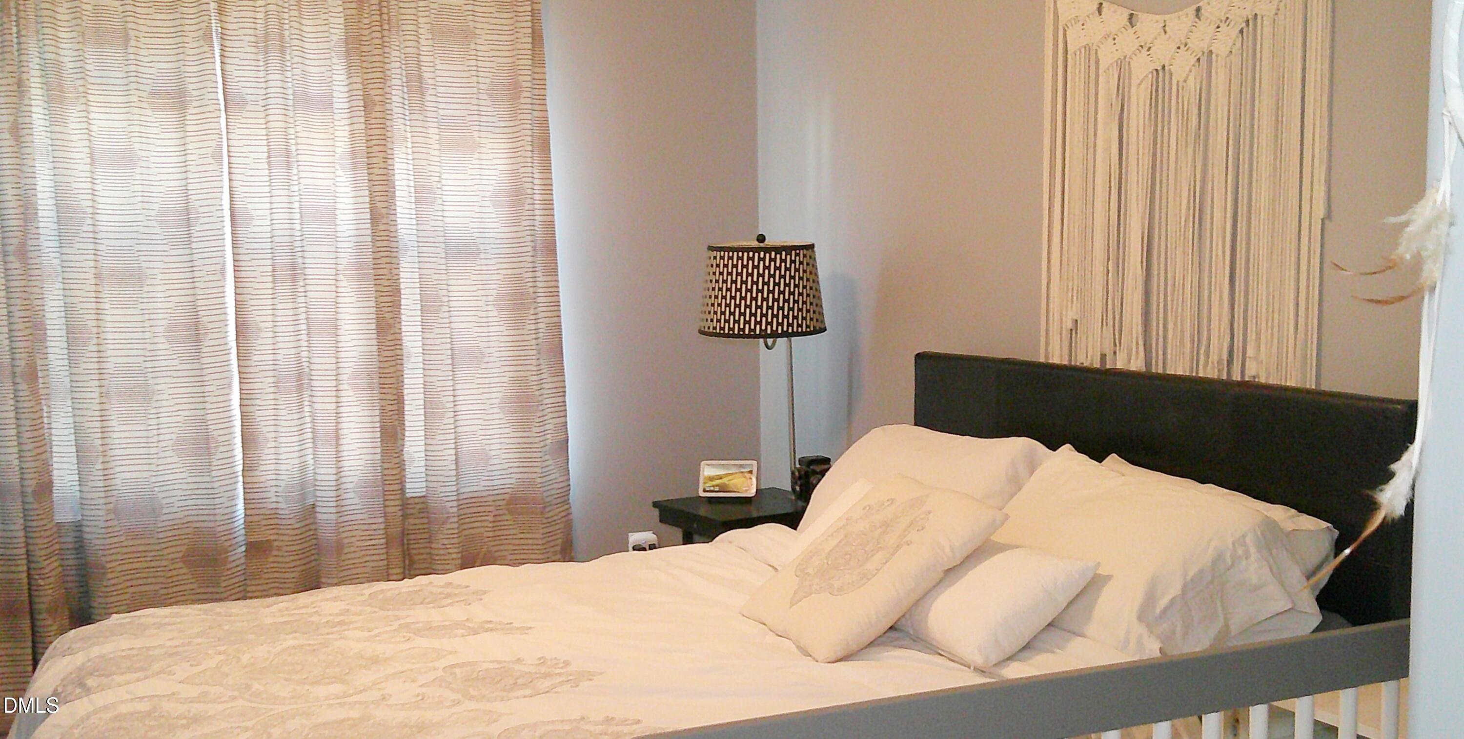 325 Huckleberry Loop Mebane, NC 27302 - Photo 13 of 24 a bedroom with a bed and a window