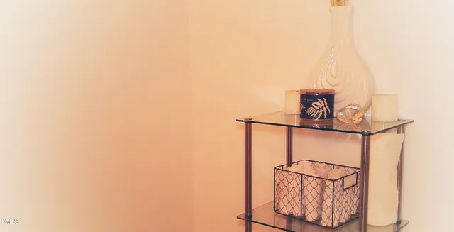 a bathroom with a shower curtain and a sink
