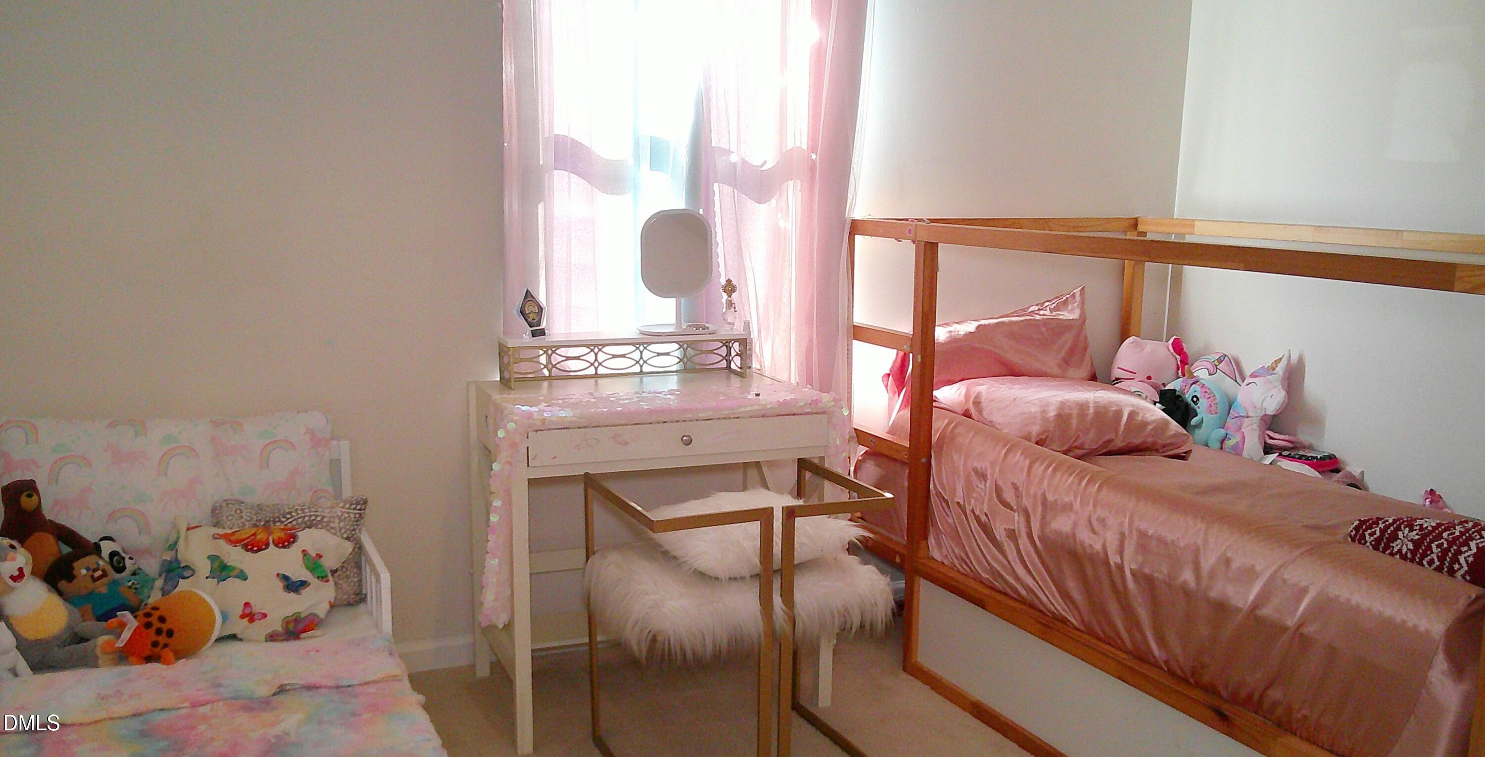 325 Huckleberry Loop Mebane, NC 27302 - Photo 21 of 24 a bedroom with a bed and a window