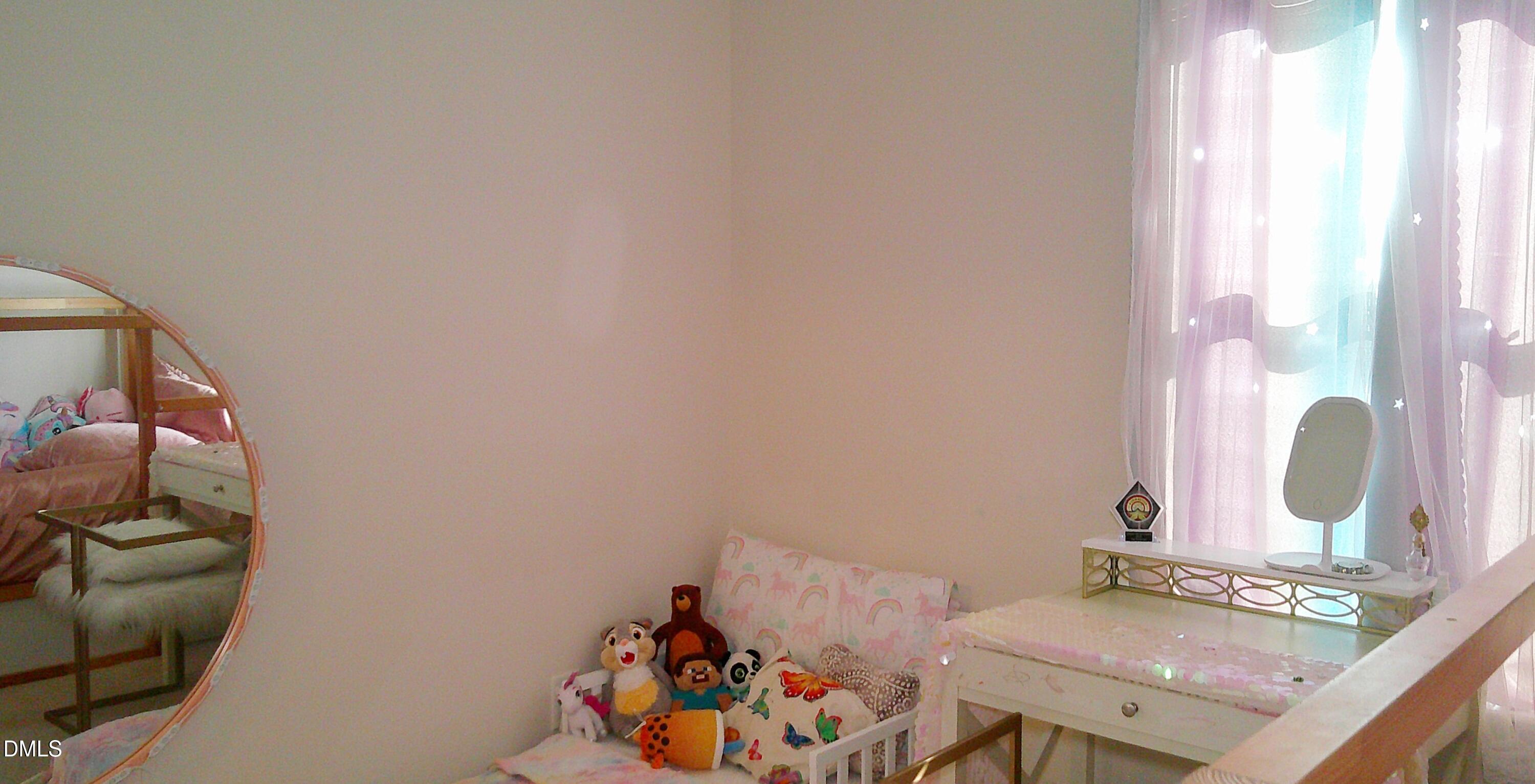 325 Huckleberry Loop Mebane, NC 27302 - Photo 22 of 24 a bedroom with a bed and a window