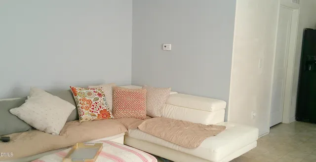 a kitchen with stainless steel appliances kitchen island granite countertop a refrigerator and a stove top oven