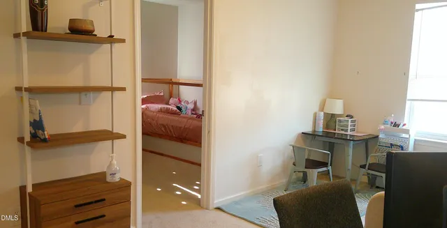 a workspace room with furniture and wooden floor