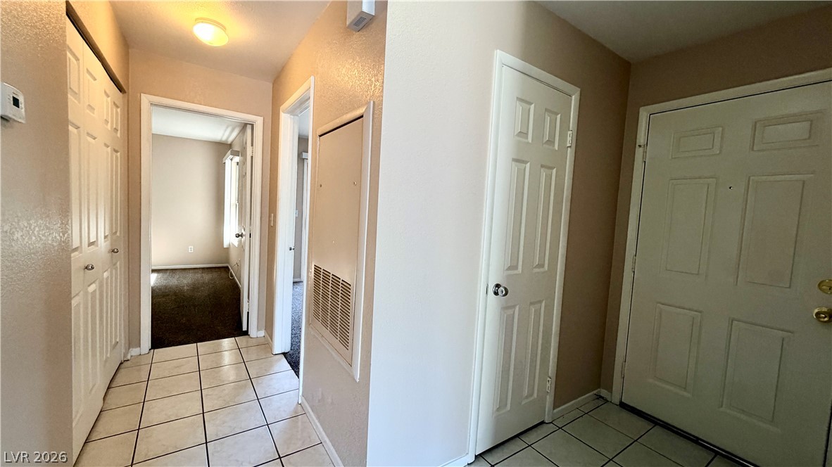 6250 West Flamingo Road, Unit 4 Las Vegas, NV 89103 - Photo 32 of 45 This entry welcomes you with classic flooring and a clear path to adjacent rooms.