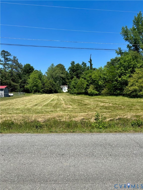 a view of a field with an ocean view