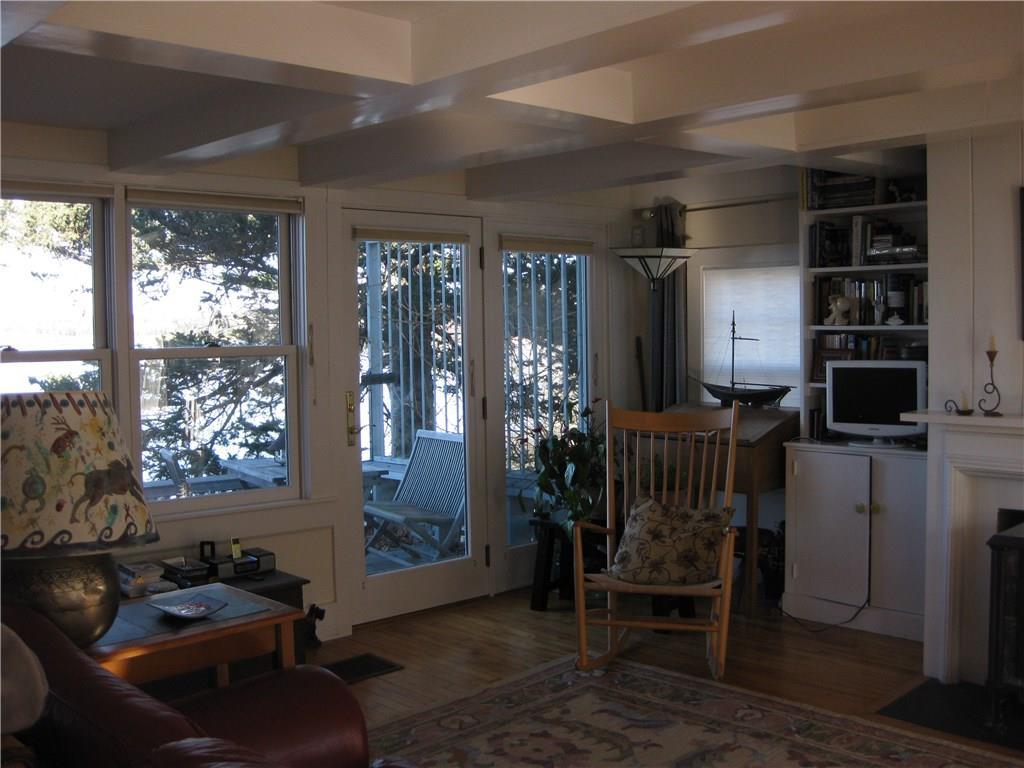 140 Wadsworth Cove Road Castine, ME 04421 - Photo 14 of 35 Living room, looking out to the deck.