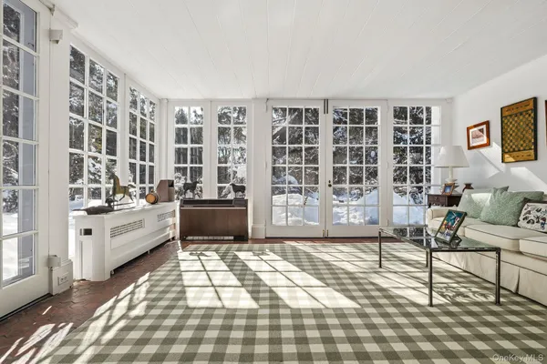 a large living room with windows