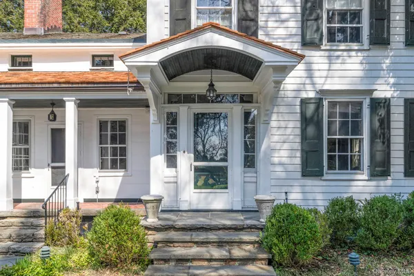 a front view of a house with a porch