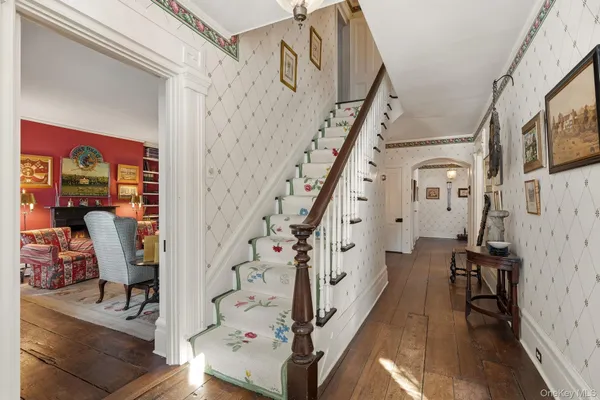 a view of entryway with wooden floor