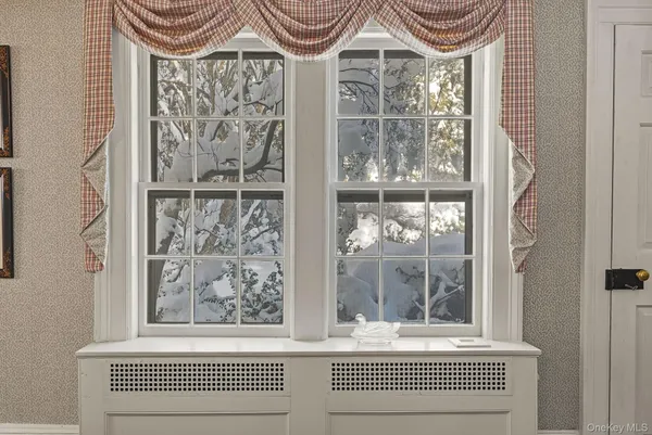 a view of a door and a window