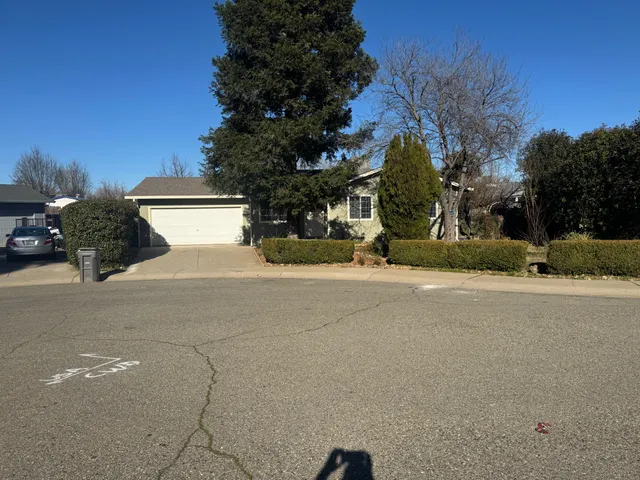 a view of a house with a street