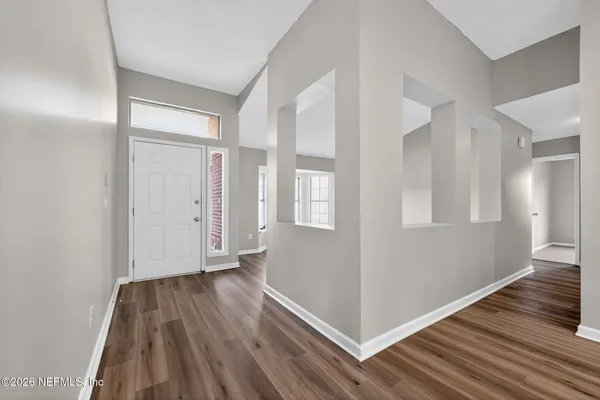 a view of livingroom with hardwood and hallway