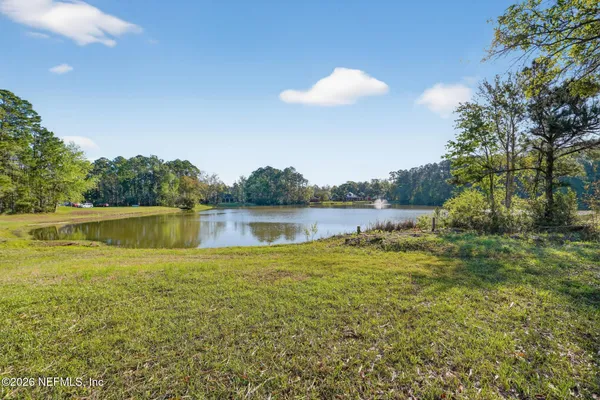 a view of a house with a big yard
