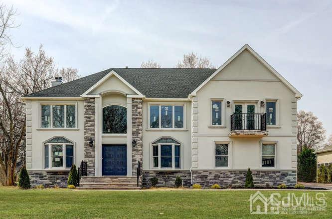7 Ramsey Road Edison, NJ 08820 - Photo 1 of 28 a front view of a house with a yard