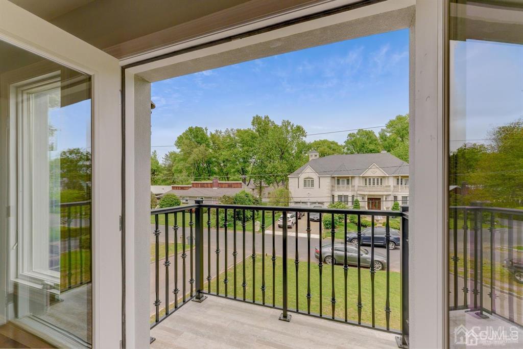 7 Ramsey Road Edison, NJ 08820 - Photo 16 of 28 a view of a balcony with a floor to ceiling window