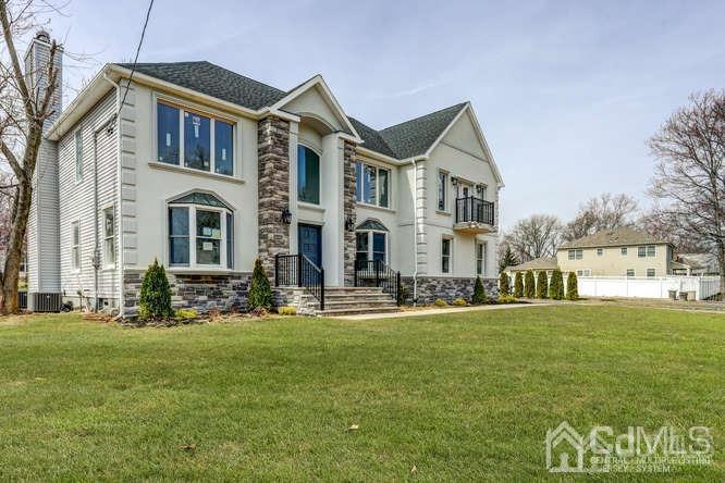 7 Ramsey Road Edison, NJ 08820 - Photo 2 of 28 a front view of building with yard