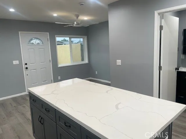 a kitchen with a stove and a refrigerator