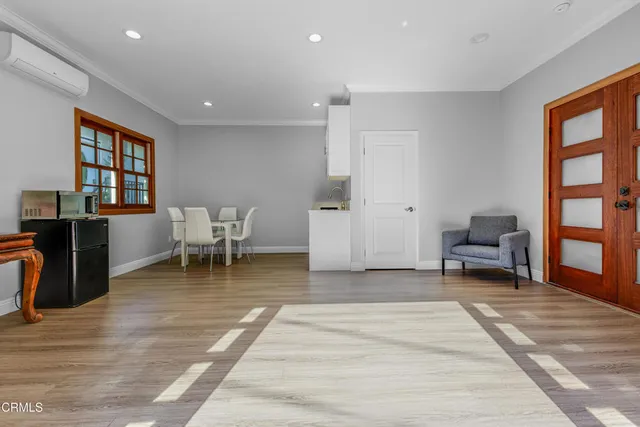 a living room with furniture and a rug