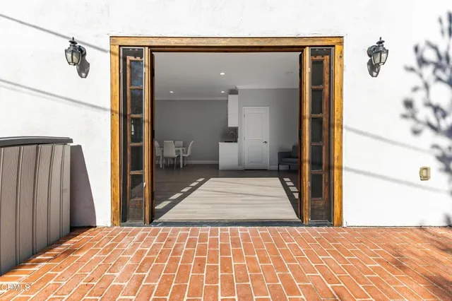 a bedroom with a bed and a mirror