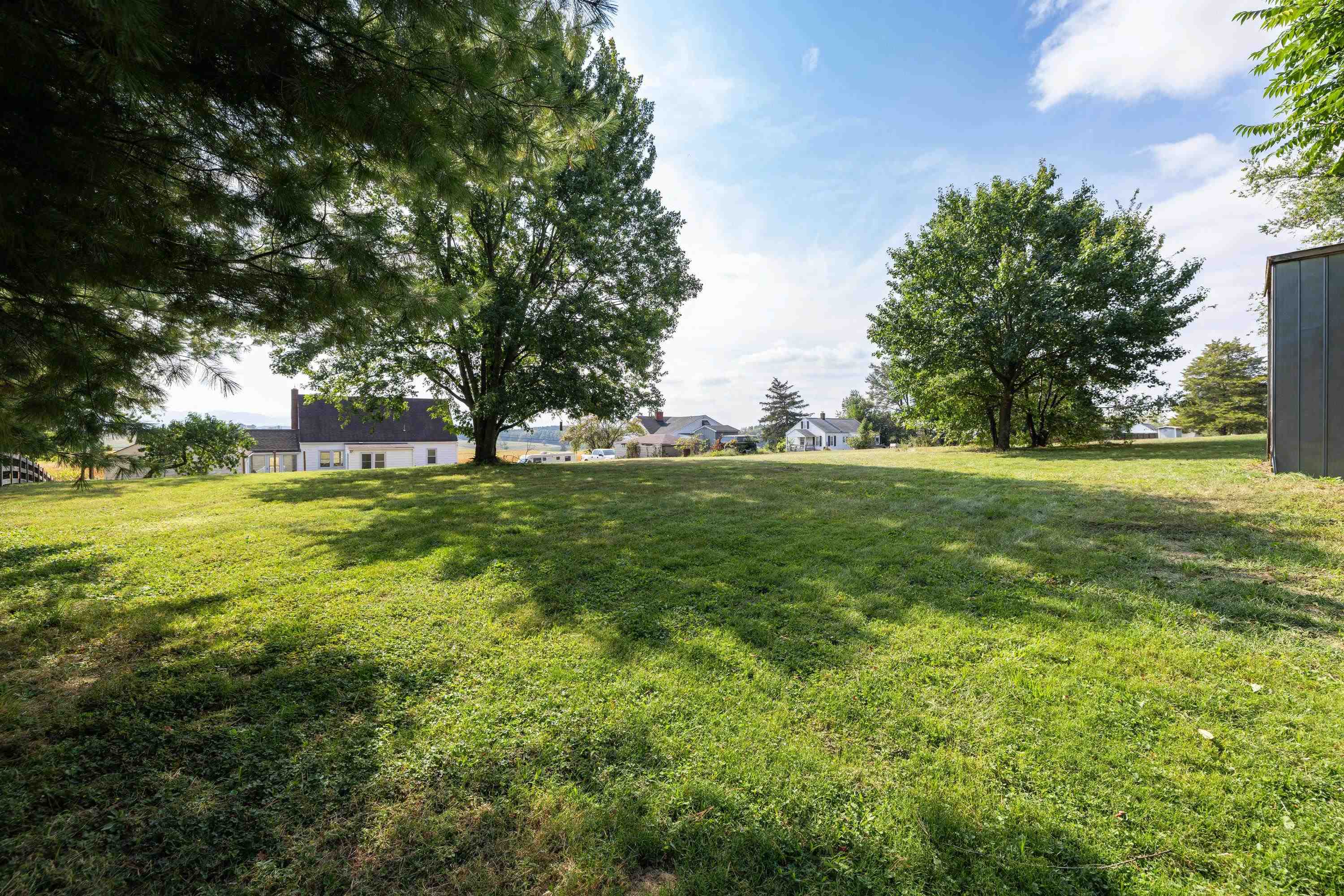 3138 Cross Keys Road Harrisonburg, VA 22801 - Photo 64 of 74 The spacious backyard area offers a shady space and open storage building.