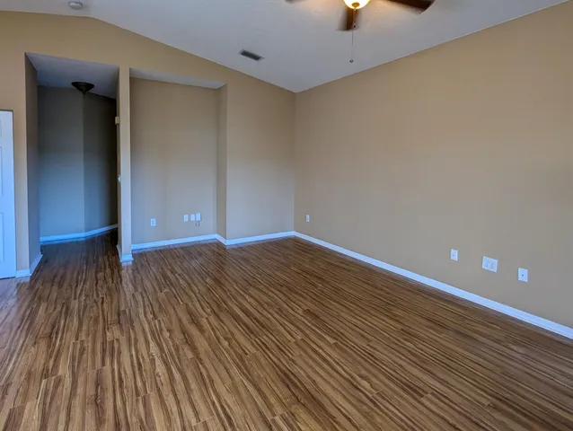 a view of a livingroom with wooden floor