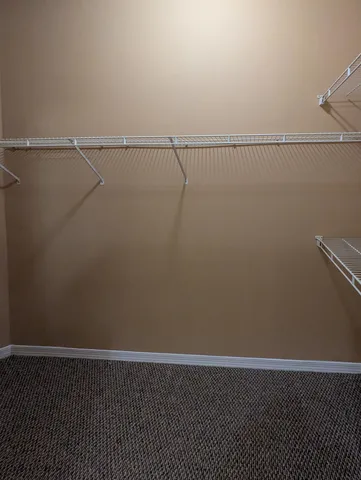 a view of a room with racks on the wall