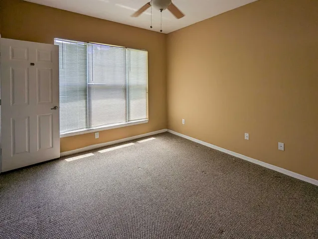 an empty room with a empty space and a window