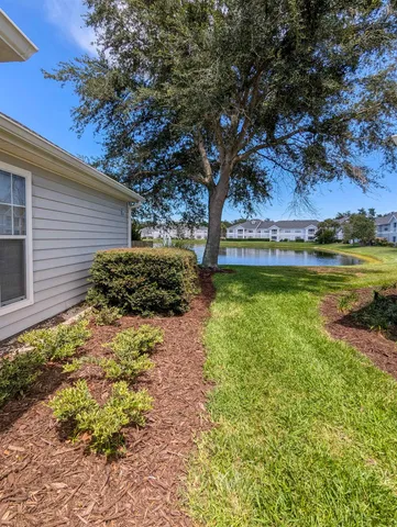 a backyard of a house with lots of green space