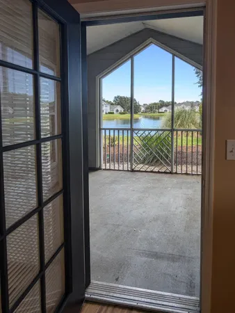 a view of outdoor space with sliding window