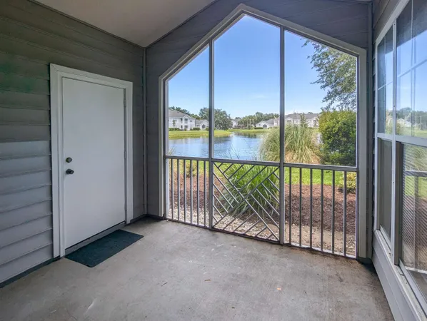 a view of a room with wooden floor and iron stairs