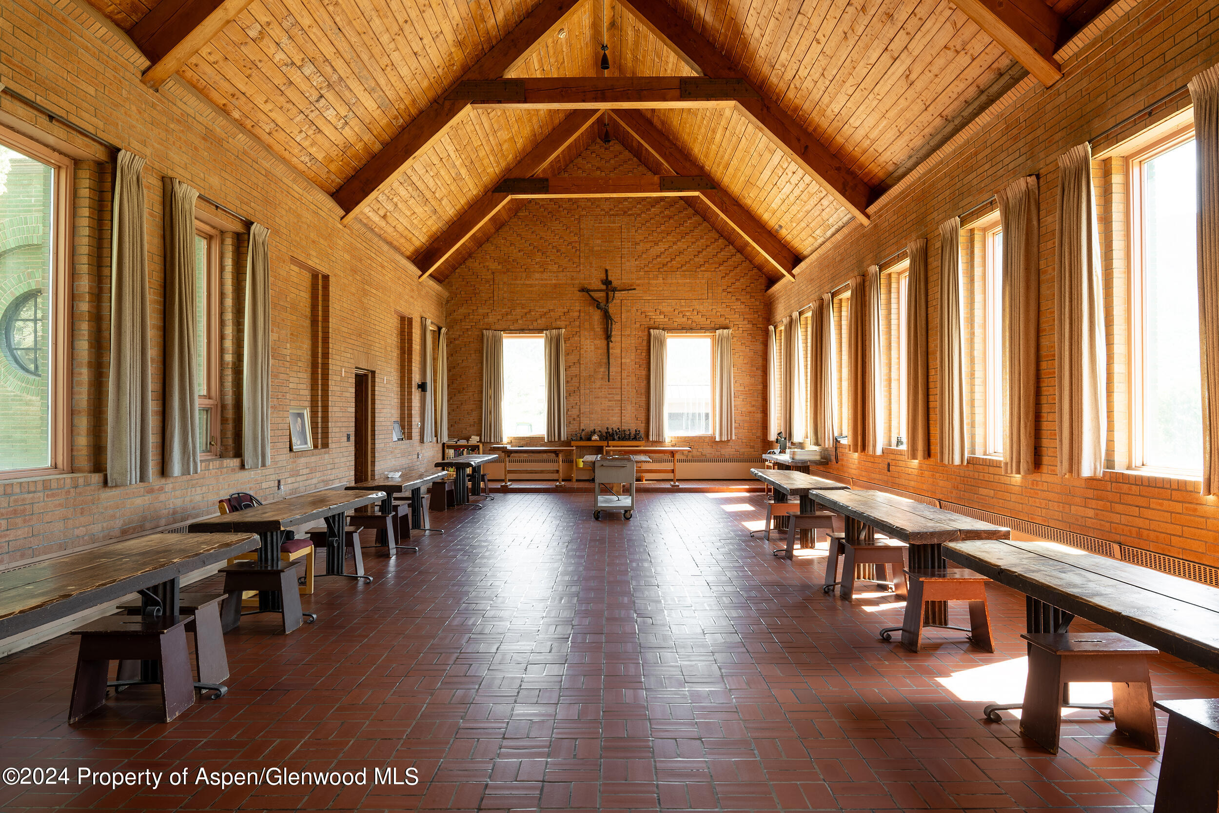 1012 Monastery Road Snowmass, CO 81654 - Photo 29 of 96 a room with lots of furniture and a large window