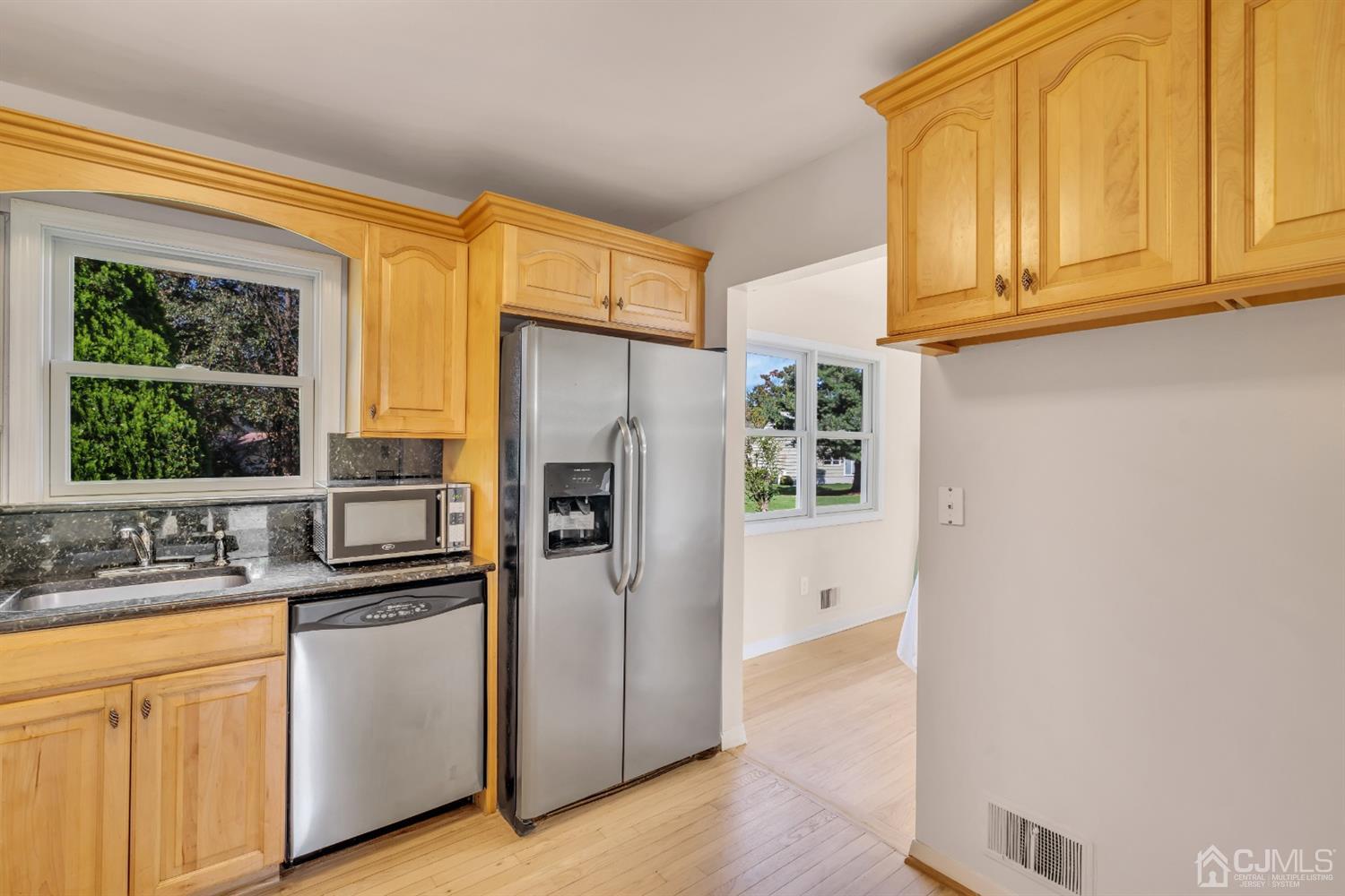9 Valiant Road East Brunswick, NJ 08816 - Photo 18 of 41 a kitchen with stainless steel appliances a refrigerator sink and cabinets