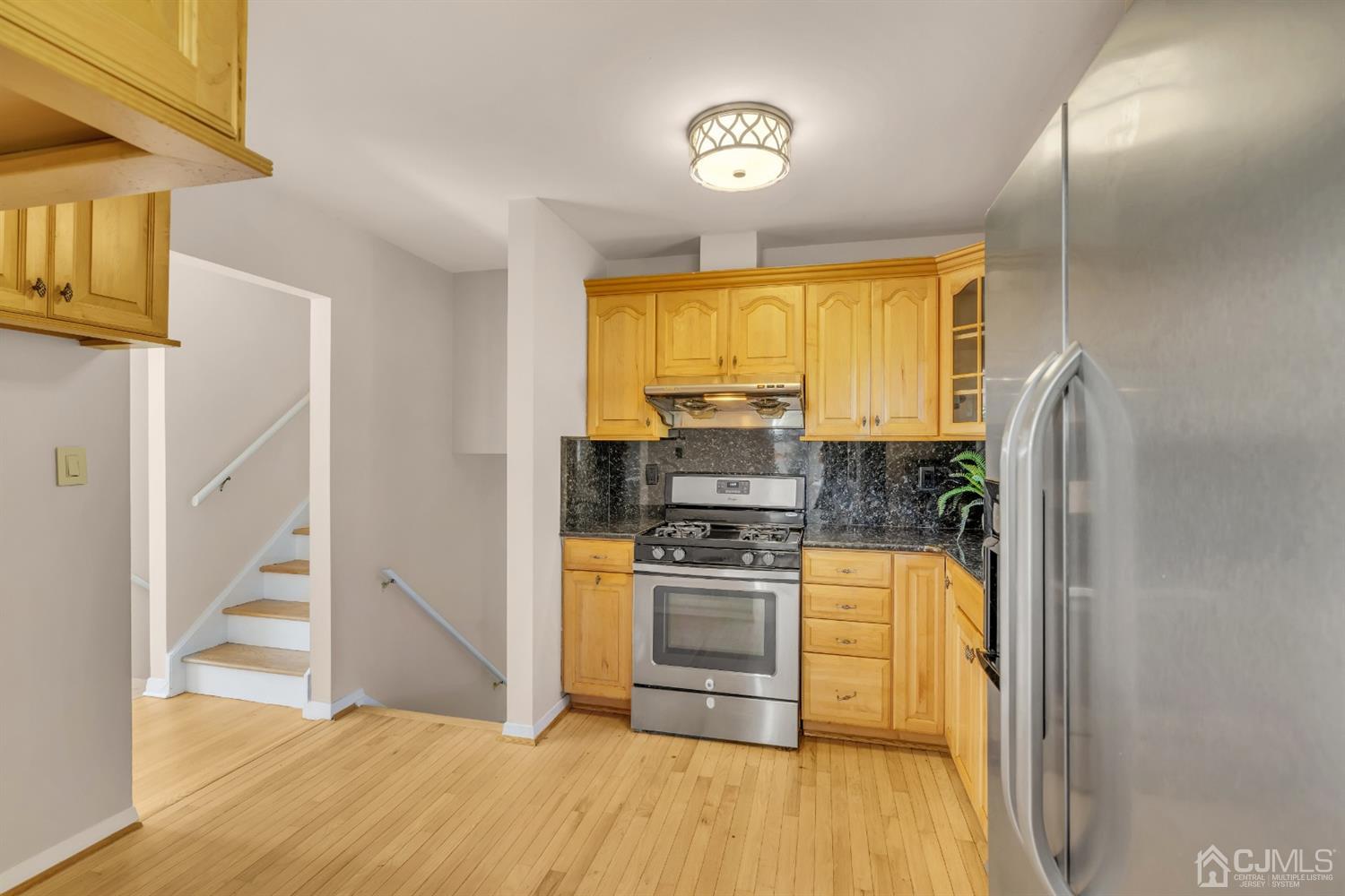 9 Valiant Road East Brunswick, NJ 08816 - Photo 19 of 41 a kitchen with stainless steel appliances granite countertop a stove a sink and a refrigerator