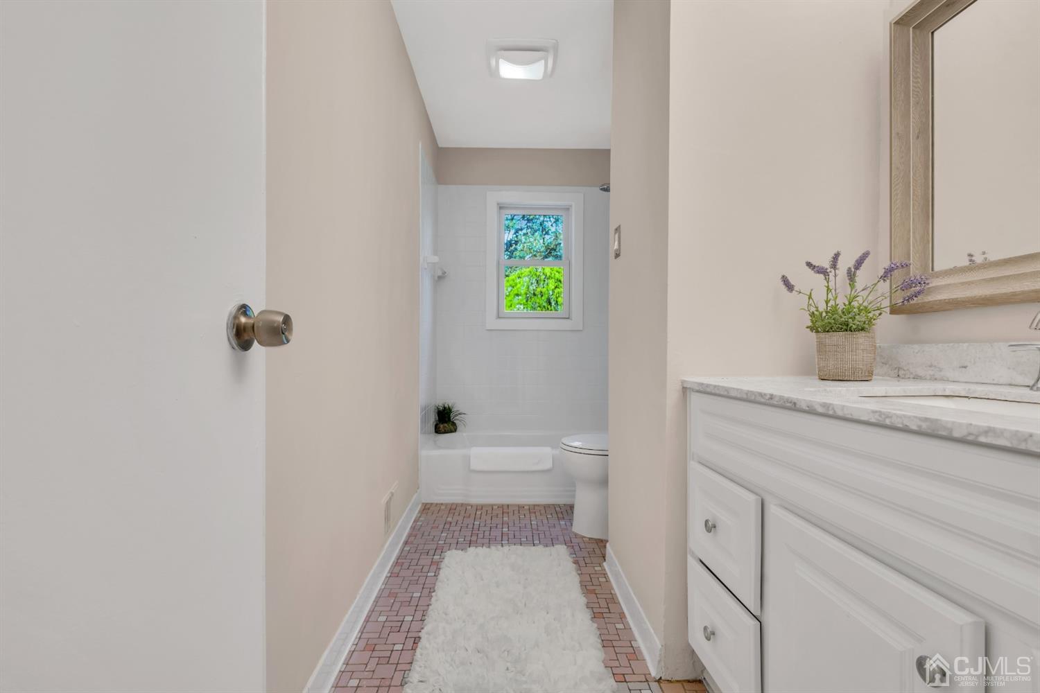 9 Valiant Road East Brunswick, NJ 08816 - Photo 29 of 41 a bathroom with a granite countertop sink a toilet and shower