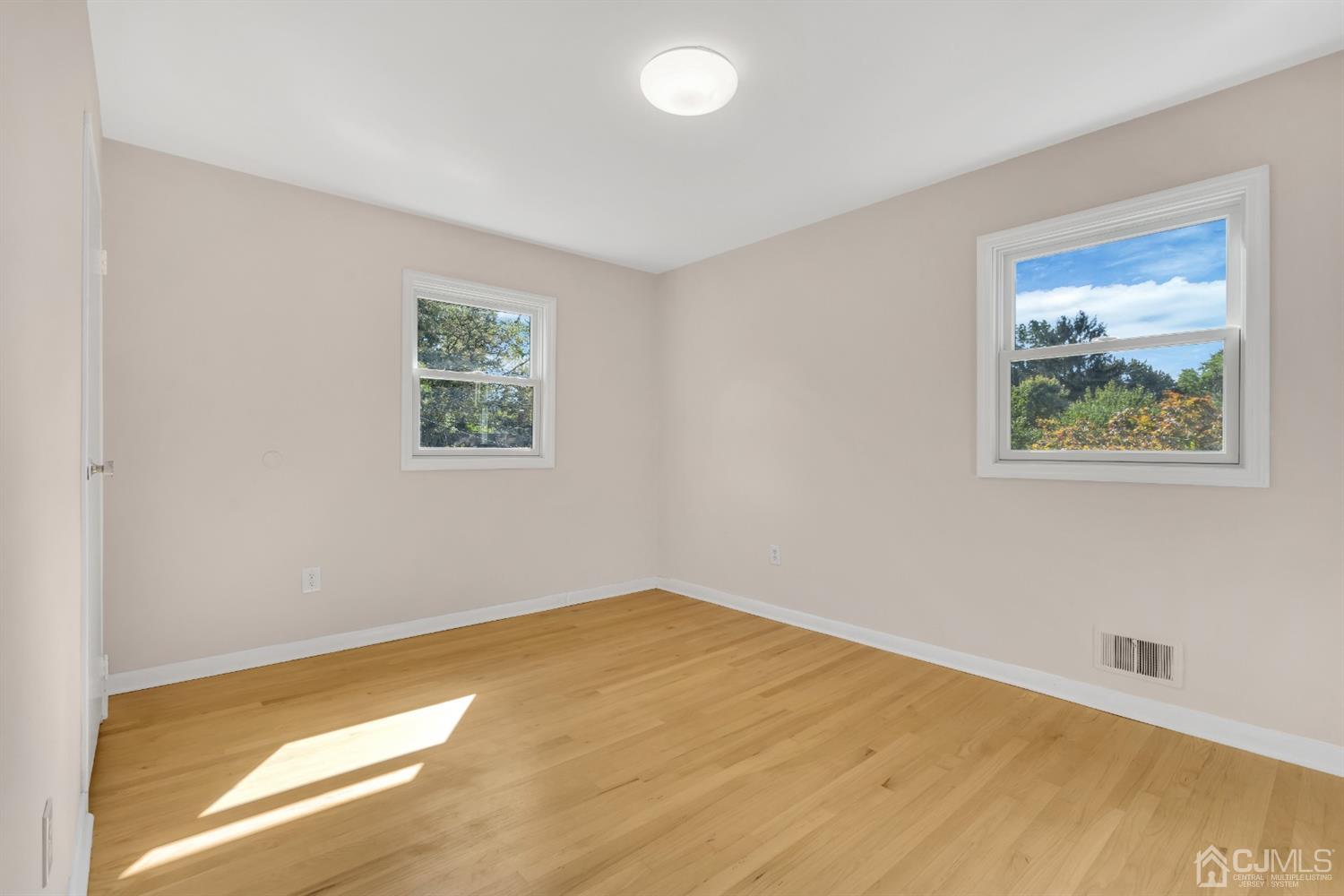 9 Valiant Road East Brunswick, NJ 08816 - Photo 31 of 41 a view of room with window and wooden floor