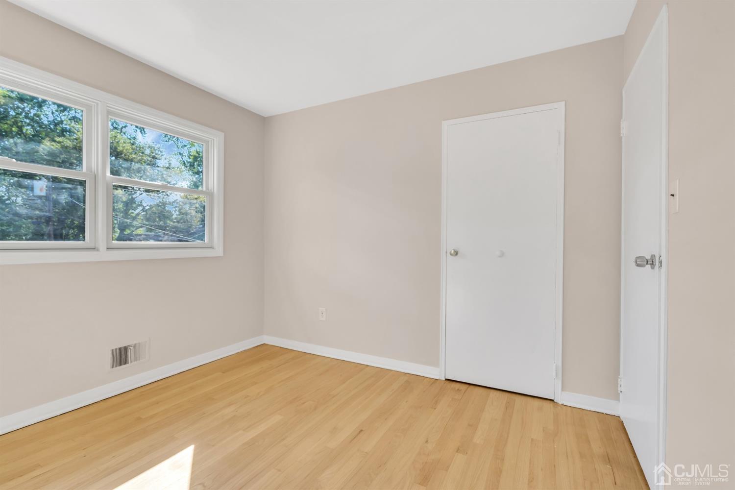 9 Valiant Road East Brunswick, NJ 08816 - Photo 33 of 41 a view of empty room with wooden floor